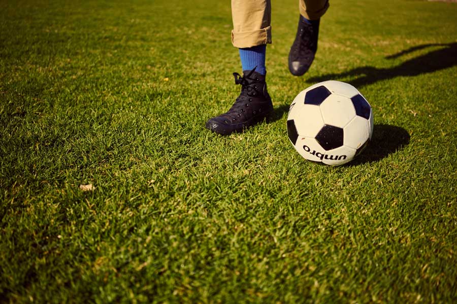 Playing-soccer-at-the-park-900x600